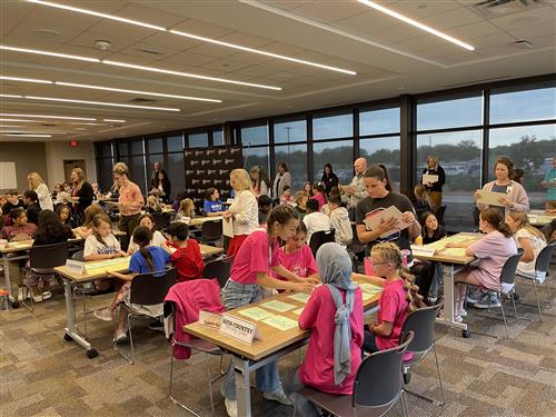 Students sitting in large room